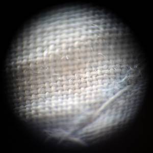 Волокна ткани под микроскопом